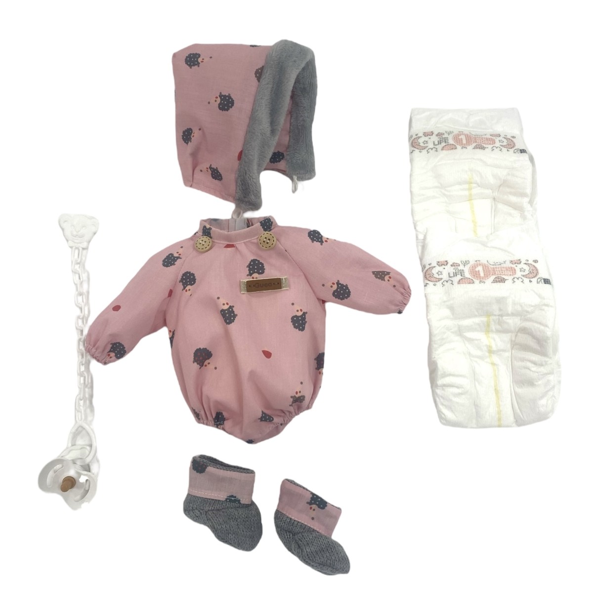 Vêtements reborn : barboteuse rose,...