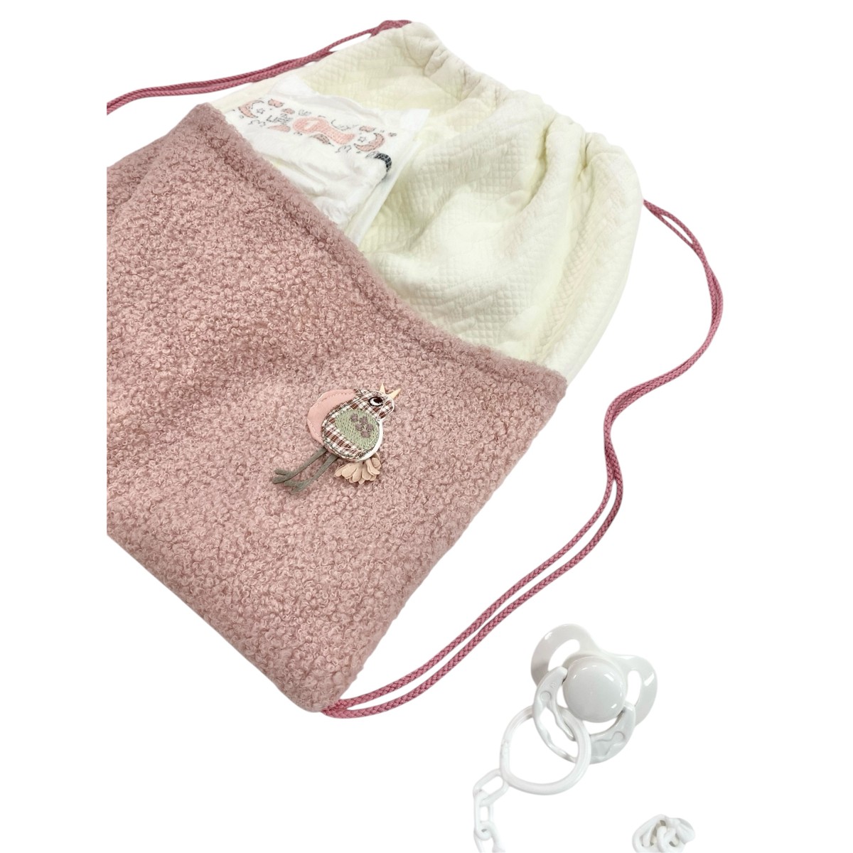 Mochila Guca, con pañales y chupete...